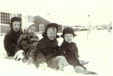 Bill, Jeanne, Bob and Bruce in the snow at 831 Hayes Avenue Cuyahoga Falls, Ohio